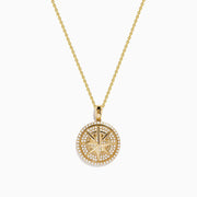 14K yellow gold diamond compass pendant featuring a round medallion with star design and sparkling diamonds around the edge, suspended on a delicate gold chain—a radiant look inspired by the Effy Pendant.
