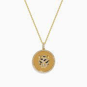 Signature 14K Yellow Gold Diamond and Emerald Panther Pendant features a round medallion with sparkling diamonds, emerald accents, and a delicate gold chain. Displayed against a white background.
