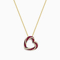 The 14K Yellow Gold Ruby and Diamond Pave Heart Pendant features an open heart design set with alternating red rubies and white diamonds on a gold chain.
