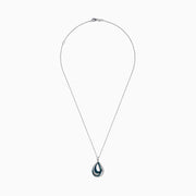 The 14K White Gold Blue and White Diamond Pear Crossover Pendant features blue and white diamonds in a swirling pattern, set on a delicate chain for a modern, intricate look.