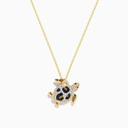 The Seaside 14K yellow gold turtle pendant features white, black, and brown diamonds for a sparkling, eye-catching look.