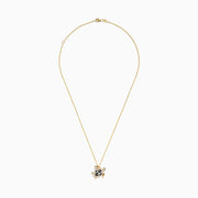 The Seaside 14K yellow gold turtle pendant features white, black, and brown diamonds for a sparkling, eye-catching look.