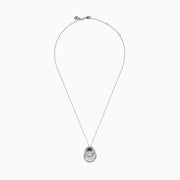 The 14K White Gold Diamond Overlapping Circle Pendant features three intertwined loops, two adorned with sparkling diamonds, suspended from a fine chain against a white background.