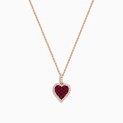 The Ruby Royale 14K Rose Gold Ruby and Diamond Heart Pendant features a ruby heart centerpiece, accented with dazzling diamonds on a rose gold chain.