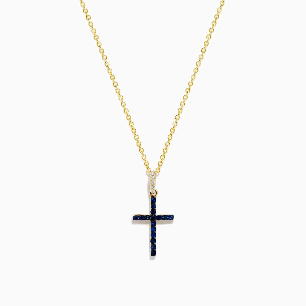 The Novelty 14K Yellow Gold Sapphire and Diamond Cross Pendant features a cross adorned with sapphires and sparkling diamonds, shown on a plain white background.