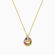 The Watercolors 14K Yellow Gold Multi Sapphire and Diamond Open Circle Pendant features a circular yellow gold design with colorful sapphires and a vertical bar of diamonds, shown on a white background.
