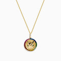 The 14K Yellow Gold Emerald Multi Sapphire and Diamond Panther Pendant features two hands holding a diamond, encircled by multi sapphires, on a delicate gold chain, reminiscent of a panther design.