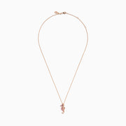 The 14K Rose Gold Pink Sapphire and Diamond Pave Seahorse Pendant features pink sapphires, diamond accents, and a small black gemstone eye, all set in rose gold and displayed against a white background.