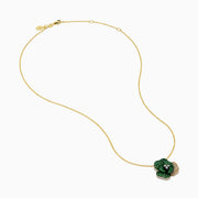 The 14K Yellow Gold Tsavorite and Diamond Flower Pendant features a floral design with one petal set with diamonds and the others adorned with vibrant green tsavorites.