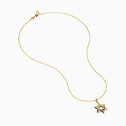 Novelty 14K Yellow Gold Star of David Diamond Pendant displayed on a gold chain, featuring sparkling diamonds set along the edges of the star, shown against a plain white background.