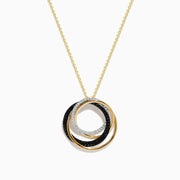 The 14K Yellow Gold Diamond and Black Diamond Circles Pendant features three interlocking rings—yellow gold, black diamond, and silver-toned with small gems—displayed on a white background.