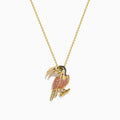 The 14K Yellow Gold Pink Sapphire and Diamond Pave Toucan Pendant features a parrot-shaped toucan with pink sapphire, diamond accents, a gold beak and claws, all on a fine yellow gold chain.