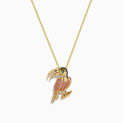 The 14K Yellow Gold Pink Sapphire and Diamond Pave Toucan Pendant features a parrot-shaped toucan with pink sapphire, diamond accents, a gold beak and claws, all on a fine yellow gold chain.