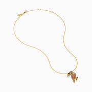 The 14K Yellow Gold Pink Sapphire and Diamond Pave Toucan Pendant features a parrot-shaped toucan with pink sapphire, diamond accents, a gold beak and claws, all on a fine yellow gold chain.