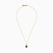 The 14K Two Tone Emerald Double Halo Pendant features a teardrop-shaped emerald accented by yellow and white diamonds on a gold chain.