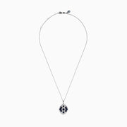 The 14K White Gold Sapphire and Diamond Vintage Pendant features deep blue sapphires and sparkling diamonds in a geometric design, suspended from a delicate white gold chain, all displayed on a white background.