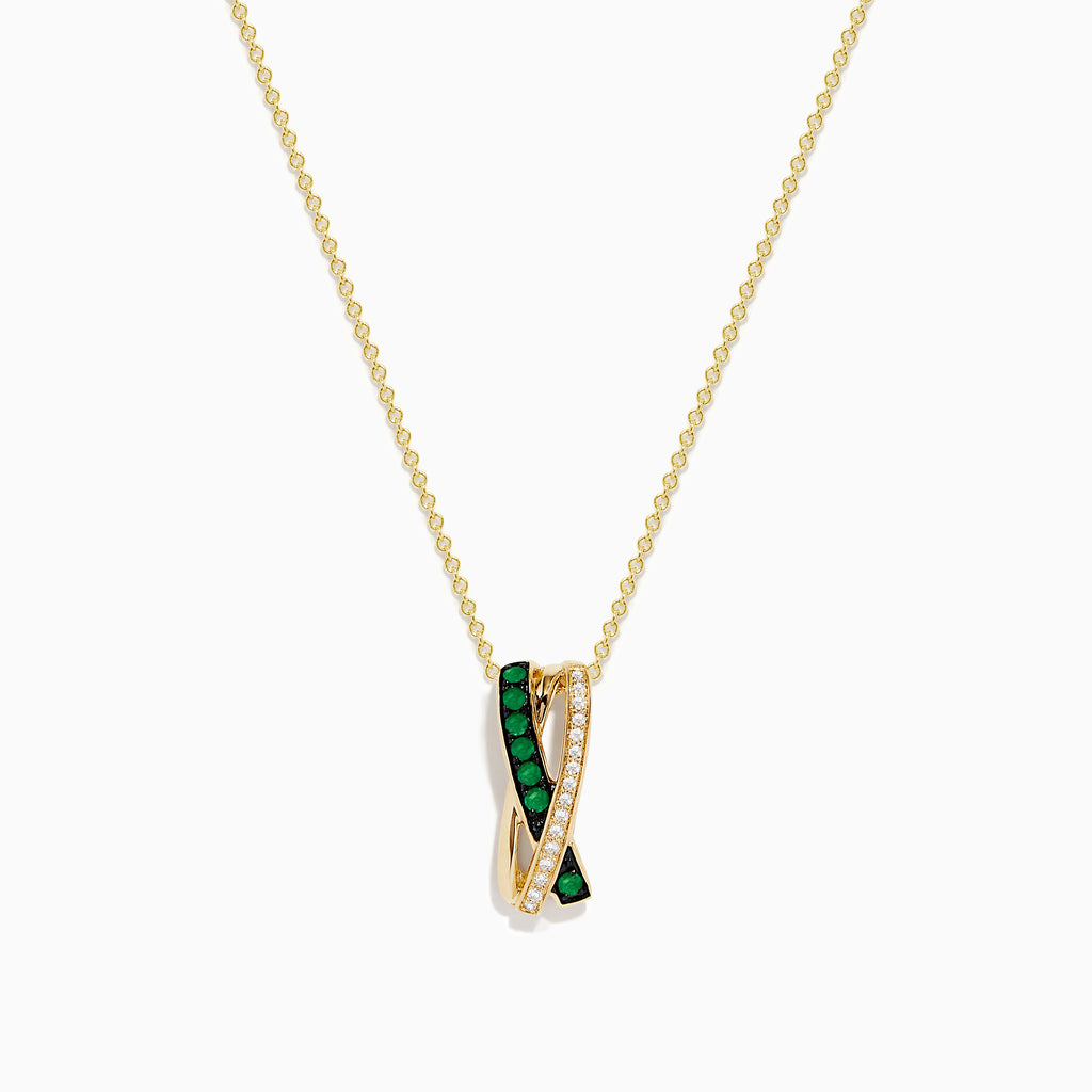 The 14K Yellow Gold Emerald and Diamond Crossover Pendant features interwoven bands—one set with emeralds, the other with sparkling diamonds—on a delicate gold chain for an elegant effect.