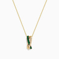 The 14K Yellow Gold Emerald and Diamond Crossover Pendant features interwoven bands—one set with emeralds, the other with sparkling diamonds—on a delicate gold chain for an elegant effect.