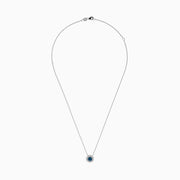 The Bella Bleu 14K White Gold Blue and White Diamond Pendant (1.60 TCW) features a flower-shaped design with a central blue stone and sparkling white diamonds, suspended on a fine chain against a plain white background.