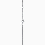 The 18K Two Toned White & Yellow Diamond Layered Doble Halo Pendant features a double-strand silver necklace with a pear-shaped yellow gemstone, diamond halos, and additional round diamonds on layered chains.