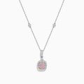 An 18K Two Tone Gold White and Pink Diamond Pendant featuring a square white diamond with a pink center stone, accented by two halos of sparkling white diamonds on a silver chain set with small diamonds.