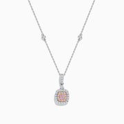 An 18K Two Tone Gold White and Pink Diamond Pendant featuring a square white diamond with a pink center stone, accented by two halos of sparkling white diamonds on a silver chain set with small diamonds.