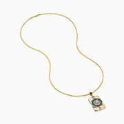 Men's 14K two tone gold dog tag pendant features a diamond ship’s wheel with blue and white diamonds, accented by silver anchors at the top and bottom.