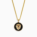 Mens 14K Yellow Gold Black Diamond Lion Pendant features a detailed lion head on a black background, set in a circular gold frame for bold elegance.