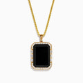 The Mens 14K Yellow Gold Black Onyx and Diamond Pendant features a rectangular black onyx bordered by diamonds, hanging from a delicate gold chain against a white background.