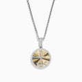 This Novelty 14K white and yellow gold coin pendant features a diamond anchor at the center of a gold sunburst design, all set on a silver chain and surrounded by a border of sparkling diamonds.