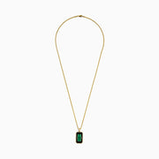 Men's 14K yellow gold dog tag pendant featuring malachite bordered by black onyx and gold accents, divided horizontally by a slim black bar with sparkling details.