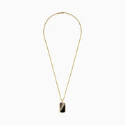 The Men's 14K Yellow Gold Onyx and Diamond Dog Tag Pendant features a rectangular design with diagonal gold and black onyx sections, separated by dazzling diamonds for a bold, modern look.