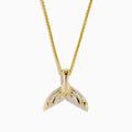 Men's 14K yellow gold diamond whales tail pendant with each fin accented by sparkling diamonds, shown on a white background.
