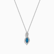 The Bella Bleu 14K Rose Gold Blue and White Diamond Pendant features a marquise-cut blue gemstone accented by white diamonds, suspended from a delicate chain against a white background.