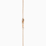 The 14K Rose Gold Brown and White Diamond Pendant features a flower-shaped design with a central brown and white diamond, accented by clear stones, shown on a white background.
