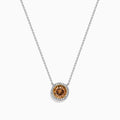 The Espresso 18K Two-Tone Gold Brown and White Diamond Necklace, featuring a round brown diamond surrounded by a halo of white diamonds, is elegantly displayed on a white background.