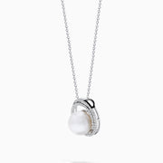 The 14K White Gold Fresh Water Pearl and Diamond Pendant features a round pendant with a central freshwater pearl, surrounded by sparkling diamonds, hanging from a fine white gold chain for an elegant look.