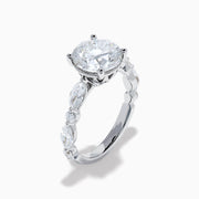 The Star Lab Grown Diamond Ring in 18K White Gold features a large oval lab diamond center with two round diamonds on each side, beautifully set and displayed on a white background.