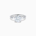 The Star Lab Grown Diamond Ring in 18K White Gold showcases a large oval-cut center stone with baguette and round accents along the band, elegantly presented on a white background.