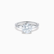 The Star Lab Grown Diamond Ring in 18K White Gold showcases a large oval-cut center stone with baguette and round accents along the band, elegantly presented on a white background.