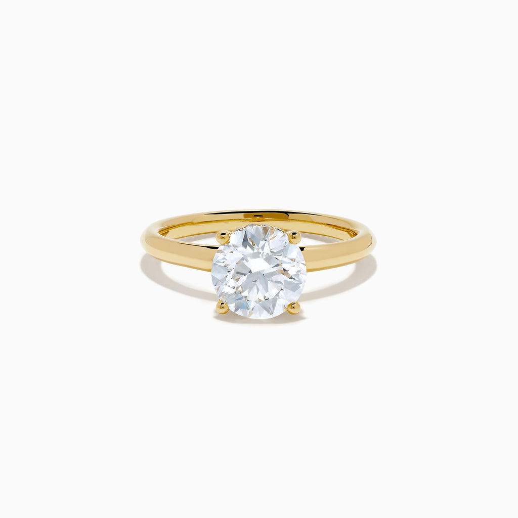 The Star Lab Grown Diamond Vine Ring in 18K yellow gold features a large round lab diamond in a classic prong setting, shown on a white background.