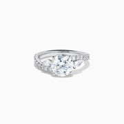 The Star Lab Grown Diamond Vine Ring in 18K White Gold features a large round lab-grown diamond center, accented with smaller diamonds along the band and an elegant vine twist design—an exquisite statement piece.