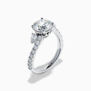 The Star Lab Grown Diamond Vine Ring in 18K White Gold features a large round lab-grown diamond center, accented with smaller diamonds along the band and an elegant vine twist design—an exquisite statement piece.