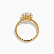 The Star Lab Grown Diamond Halo Ring in 18K Yellow Gold showcases an oval lab-grown diamond center, surrounded by a sparkling diamond halo and accented with diamonds along the band.