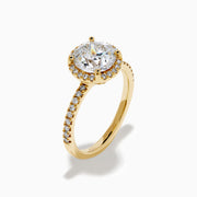 The Star Lab Grown Diamond Halo Ring in 18K Yellow Gold showcases an oval lab-grown diamond center, surrounded by a sparkling diamond halo and accented with diamonds along the band.