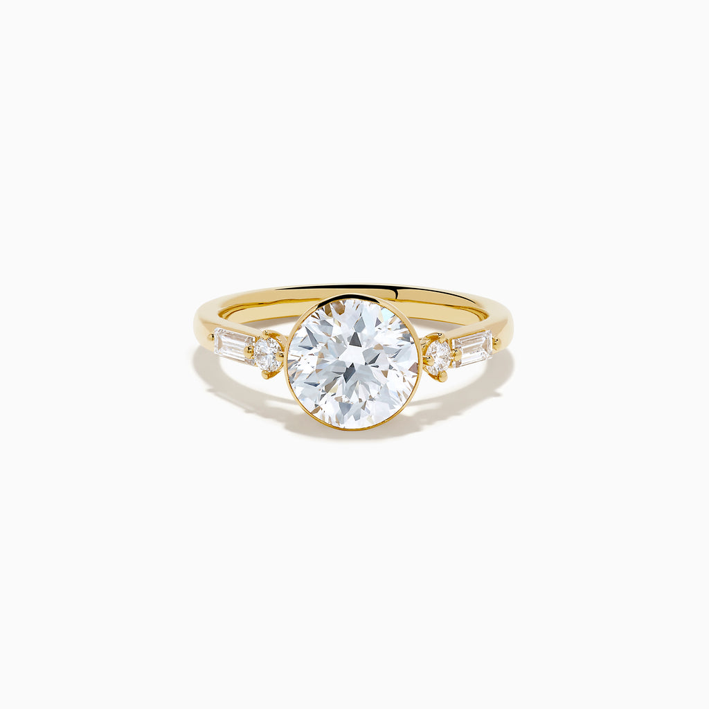 The Star Lab Grown Diamond Moderne Ring in 18K Yellow Gold features a large round lab diamond center, two smaller round diamonds, and baguette-cut side diamonds, shown on a white background.