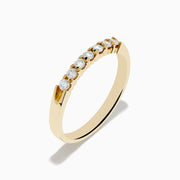 The 14K Yellow Gold 7-Stone Prong Set Diamond Band, 0.25 TCW, showcases a classic row of round white diamonds on a plain white background.