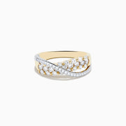 The 14K Two Tone Gold Diamond Criss Cross Ring features two overlapping bands, one set with white diamonds and the other with alternating white and yellow diamonds, finished with elegant polish and intricate detailing.