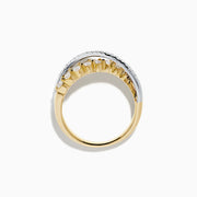The 14K Two Tone Gold Diamond Criss Cross Ring features two overlapping bands, one set with white diamonds and the other with alternating white and yellow diamonds, finished with elegant polish and intricate detailing.
