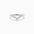 The Classique 14K White Gold Diamond Wedding Band showcases a delicate V-shaped design with sparkling round diamonds elegantly set along the band’s curve.